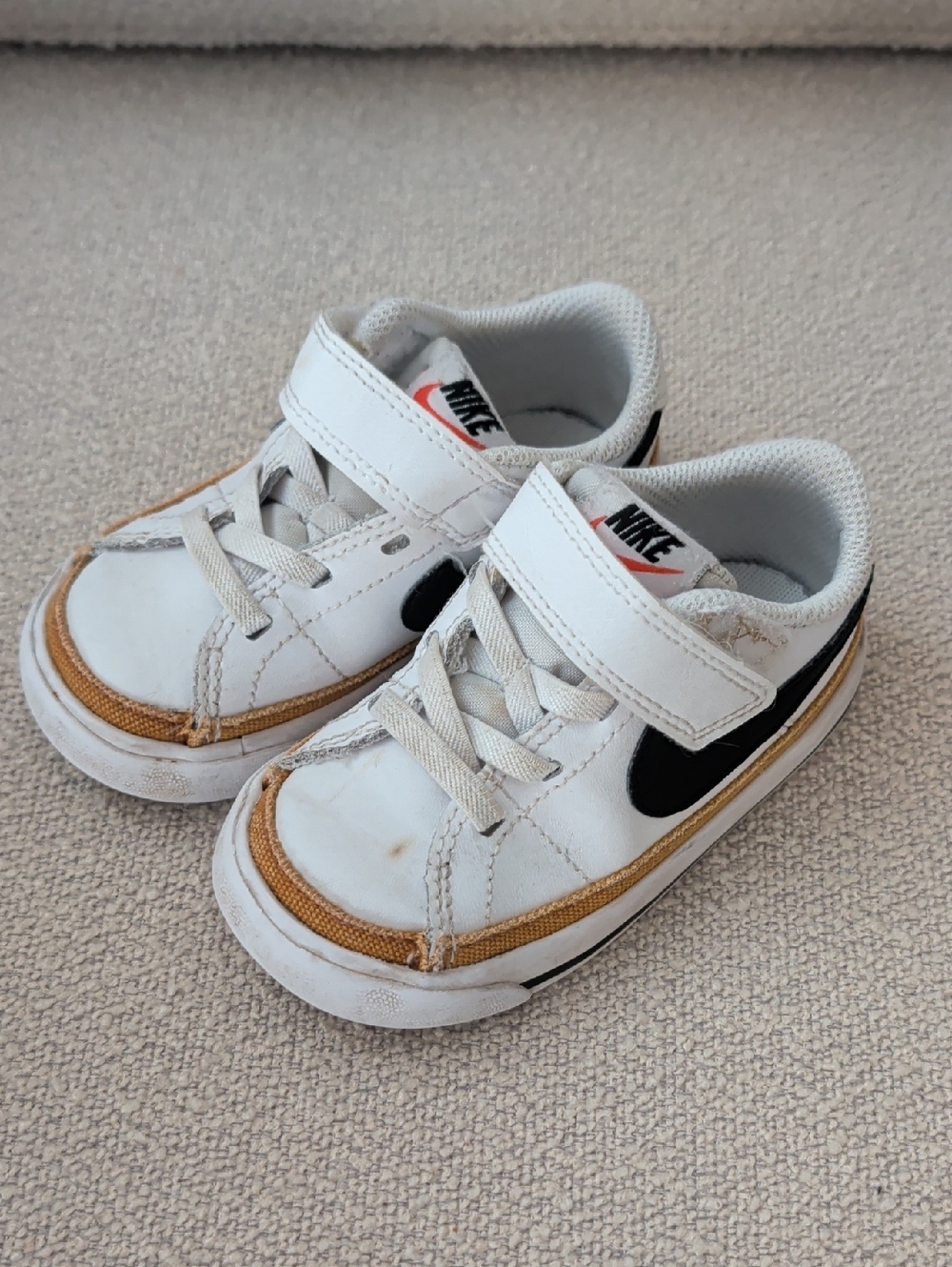 Nike Kids White Sneakers with Black Swoosh and Tan Trim